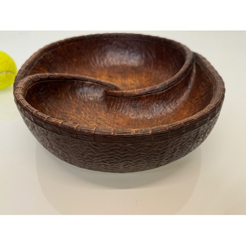 304 - Hand carved mid century wooden bowl of a yin and yang design, 31 cm x 25 cm x 7.5 cm.

This lot is a... 