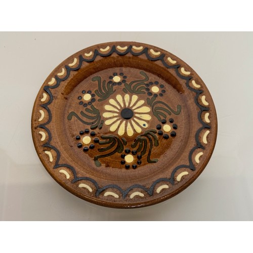 310 - A studio unmarked pottery plate with floral decoration, 23 cm diameter.

This lot is available for i... 