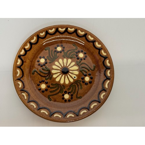 310 - A studio unmarked pottery plate with floral decoration, 23 cm diameter.

This lot is available for i... 