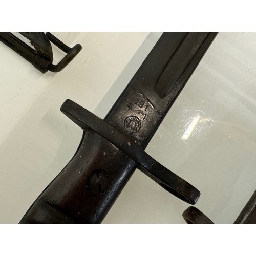 250 - Militaria, US Remington bayonet from WWI with scabbard a Wilkinson British bayonet and another.

Thi... 