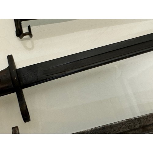 250 - Militaria, US Remington bayonet from WWI with scabbard a Wilkinson British bayonet and another.

Thi... 