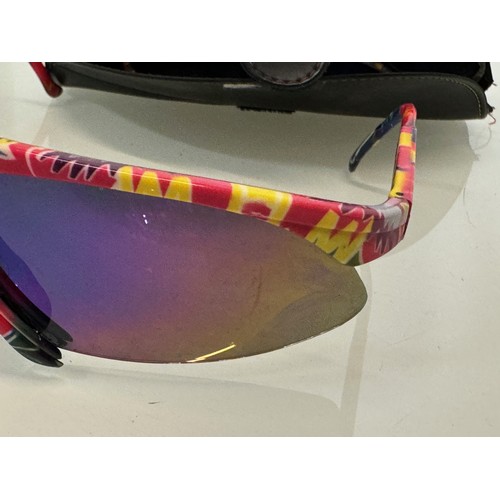 314 - Vintage ski wear, a cased pair of Bolle sunglasses, with alternative frame sections.

This lot is av... 