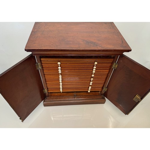 318 - Furniture, a mahogany collectors cabinet, the draws having multiple circular compartments within eac... 