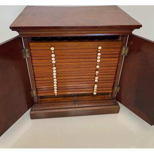 318 - Furniture, a mahogany collectors cabinet, the draws having multiple circular compartments within eac... 