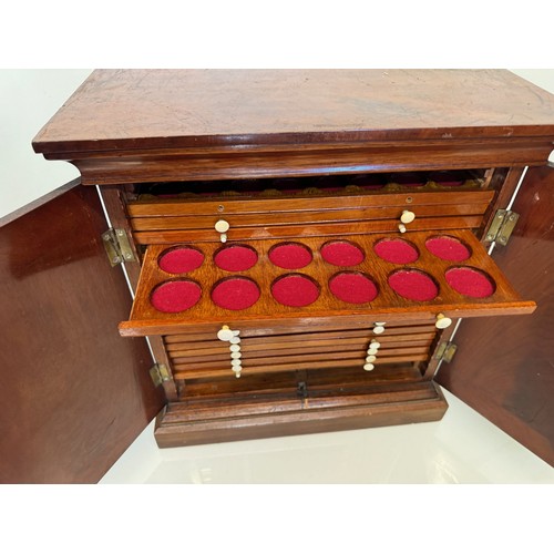 318 - Furniture, a mahogany collectors cabinet, the draws having multiple circular compartments within eac... 