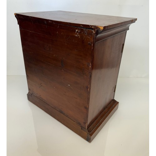 318 - Furniture, a mahogany collectors cabinet, the draws having multiple circular compartments within eac... 