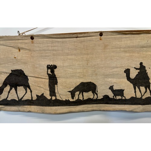 320 - Artwork, a Bedouin scene on linen, 109 cm x 27 cm.

This lot is available for in-house shipping