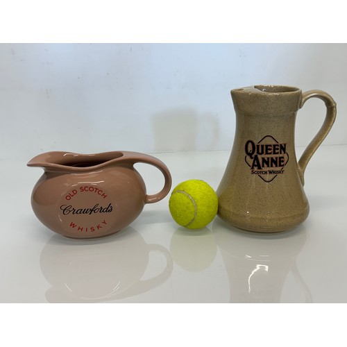 328 - Breweryana, advertising ceramics, two branded water jugs by Wade, Crawfords Whisky and Queen Anne Wh... 