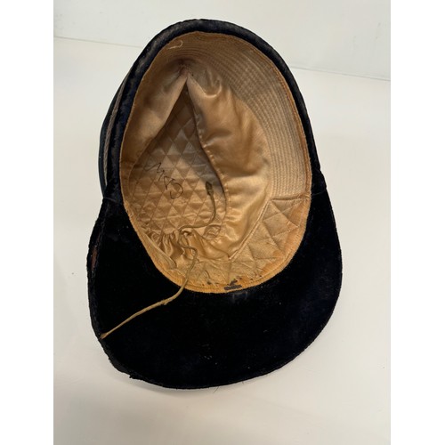 343 - Sporting equipment, a vintage deep blue velvet covered jockeys cap.

This lot is available for in-ho... 