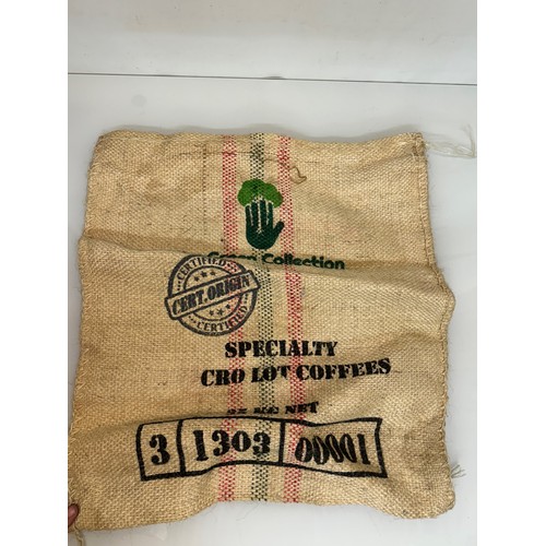 57 - Vintage hessian sack advertising The Green Collection Collumbian coffee, 73 cm x 63 cm.

This lot is... 