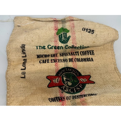 57 - Vintage hessian sack advertising The Green Collection Collumbian coffee, 73 cm x 63 cm.

This lot is... 