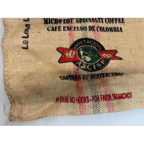 57 - Vintage hessian sack advertising The Green Collection Collumbian coffee, 73 cm x 63 cm.

This lot is... 