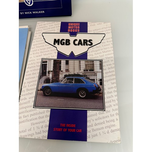 170 - Automobilia, books on Range Rovers and Land Rover Discovery and MG and more, a manual and a glass La... 