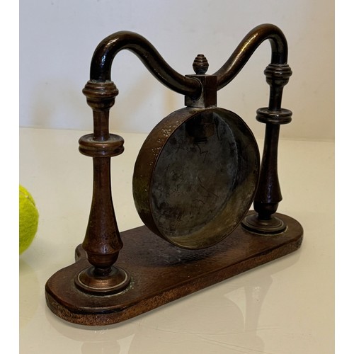 357 - Table gong, made from copper, very heavy, 24 cm wide x 18 cm tall.

This lot is available for in-hou... 