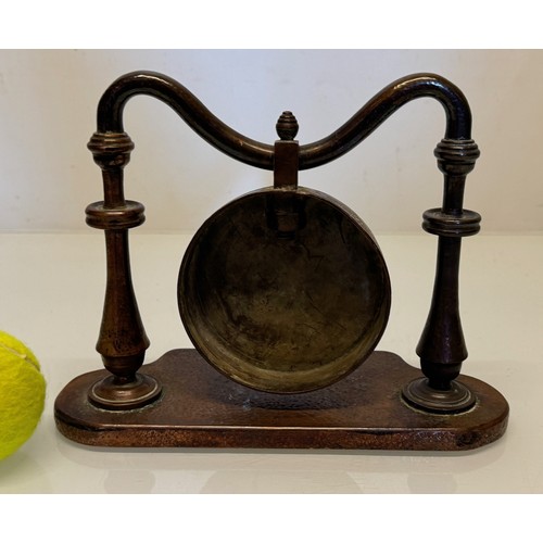 357 - Table gong, made from copper, very heavy, 24 cm wide x 18 cm tall.

This lot is available for in-hou... 