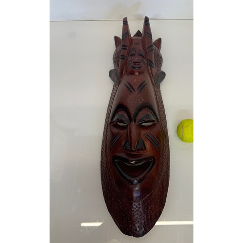 66 - Hand carved tribal art, wall hanging face mask 61 cm tall.

This lot is available for in-house shipp... 