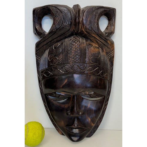 31 - Hand carved African tribal art wall mask 38 cm high.

This lot is available for in-house shipping