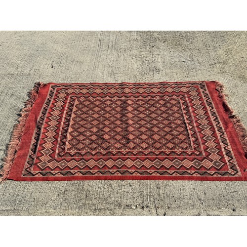 33 - Furnishings, a Hand Woven floor rug, 120 cm x 190 cm.

This lot is available for in-house shipping