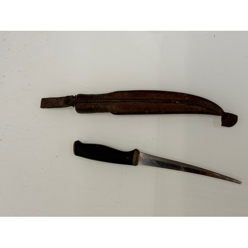 394 - A Finnish made flensing knife with a leather sheath.

This lot is available for in-house shipping