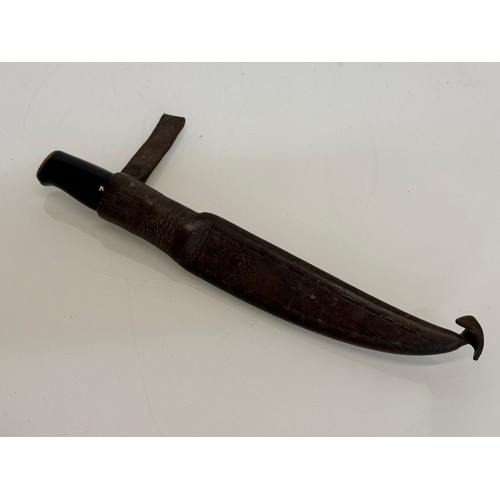 394 - A Finnish made flensing knife with a leather sheath.

This lot is available for in-house shipping