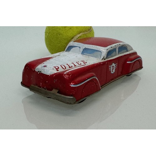 176 - Toys, automobilia, a vintage German US Zone tin plate police car with friction drive., 15 cm long.

... 