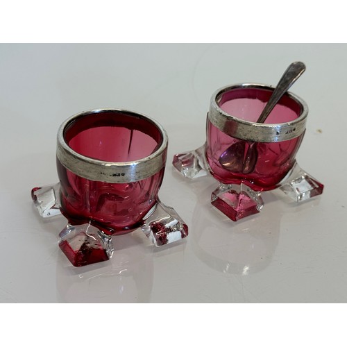 411 - Pair of ruby glass salts with indistinctly marked rims.

This lot is available for in-house shipping