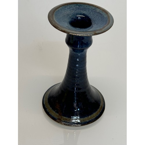 443 - Irish art pottery candle stick, signed to the base, 16 cm tall.

This lot is available for in-house ... 