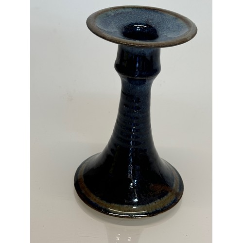 443 - Irish art pottery candle stick, signed to the base, 16 cm tall.

This lot is available for in-house ... 