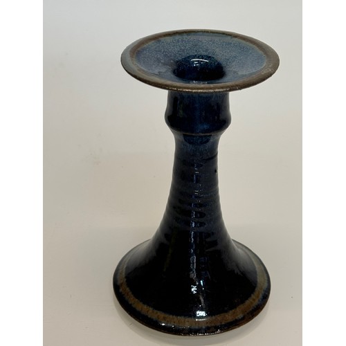 443 - Irish art pottery candle stick, signed to the base, 16 cm tall.

This lot is available for in-house ... 