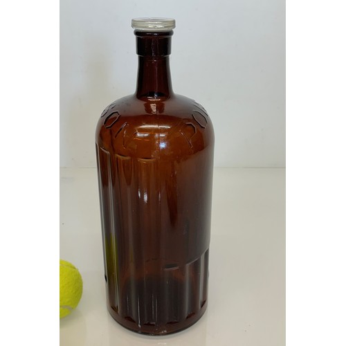 444 - an Amber glass poison bottle, 33 cm tall.

This lot is available for in-house shipping