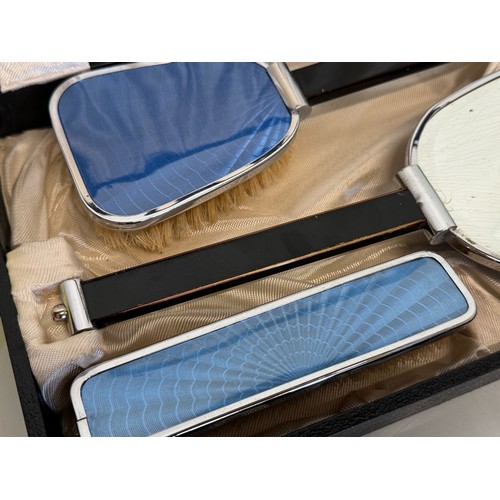 449 - Cased art deco dressing table set, 33 cm x 20 cm  x 6 cm.

This lot is available for in-house shippi... 