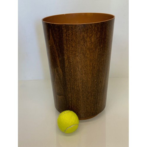 460 - Mid century furniture, a wood effect plastic bin. 22cm diameter x 33 cm tall.

This lot is available... 