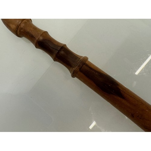 60 - A hardwood truncheon, no markings, 40 cm long.

This lot is available for in-house shipping