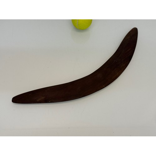 62 - Australian, Aboriginal, tribal art, a boomerang decorated with carvings of kangaroo’s, 45 cm wide.

... 