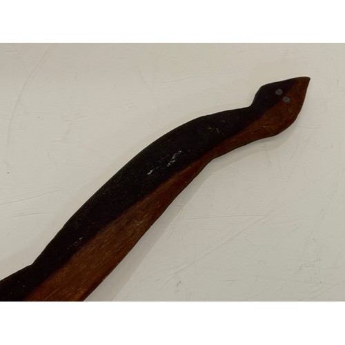 63 - Australian, Aboriginal tribal art, a hand carved serpent 42 cm long.

This lot is available for in-h... 