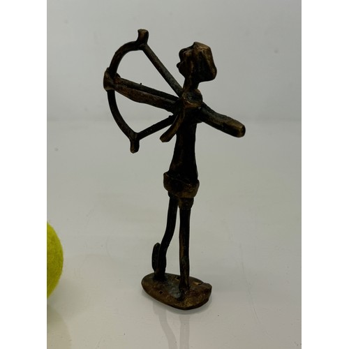 69 - Cast bronze tribal art figure of an archer. 16 cm tall.

This lot is available for in-house shipping