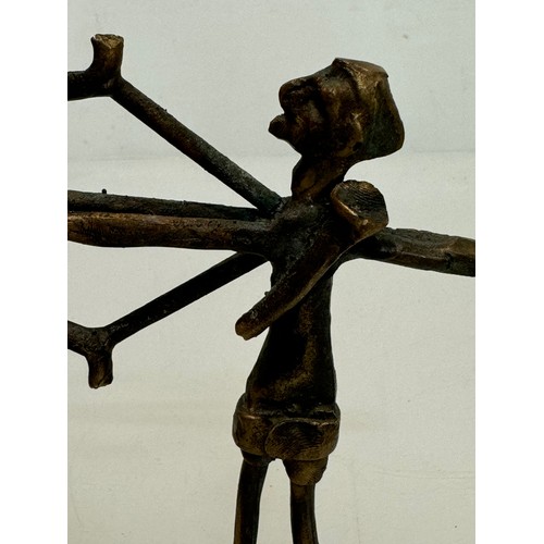 69 - Cast bronze tribal art figure of an archer. 16 cm tall.

This lot is available for in-house shipping