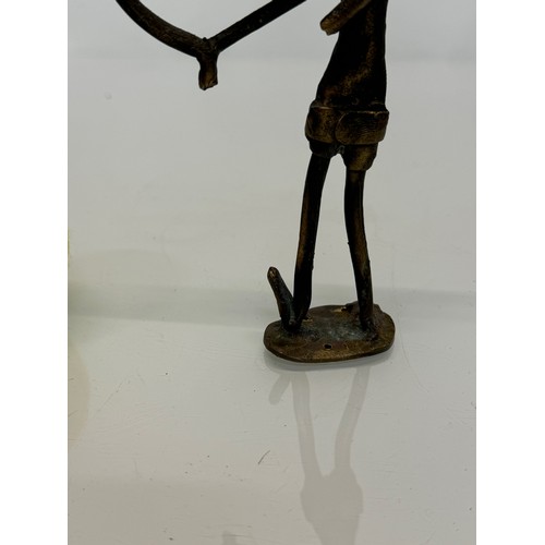 69 - Cast bronze tribal art figure of an archer. 16 cm tall.

This lot is available for in-house shipping