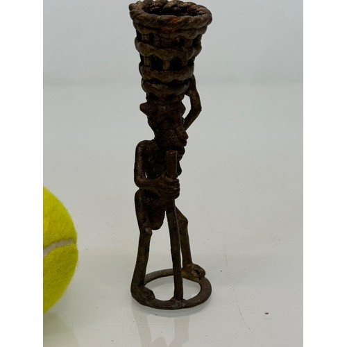 70 - Cast bronze tribal art figure with a basket on his head. 13 cm tall.

This lot is available for in-h... 