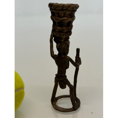 70 - Cast bronze tribal art figure with a basket on his head. 13 cm tall.

This lot is available for in-h... 