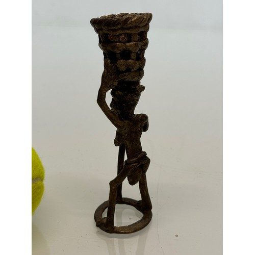 70 - Cast bronze tribal art figure with a basket on his head. 13 cm tall.

This lot is available for in-h... 