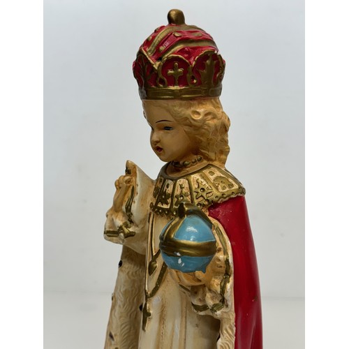 71 - A decorated plaster relique, a religious figure, 37 cm tall.

This lot is available for in-house shi... 