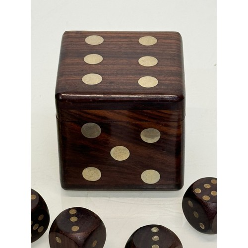 79 - Gambling, gaming interest, a treen Dice, a hardwood box in the inlaid in the form of a dice containi... 