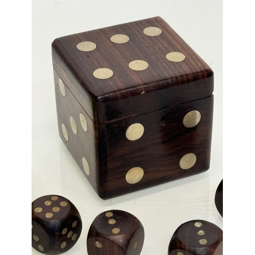 79 - Gambling, gaming interest, a treen Dice, a hardwood box in the inlaid in the form of a dice containi... 