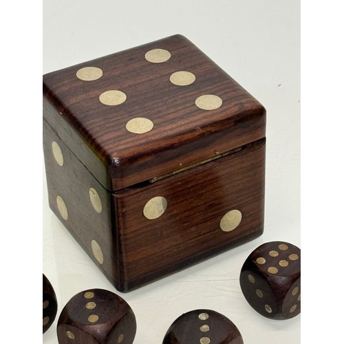 79 - Gambling, gaming interest, a treen Dice, a hardwood box in the inlaid in the form of a dice containi... 