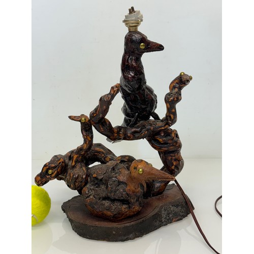 82 - Naive art, a French folk art lamp base from a carved vine section as bird and snake figures amongst ... 