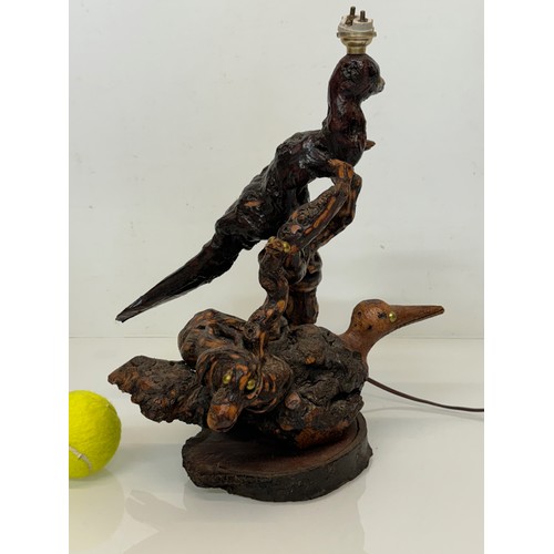 82 - Naive art, a French folk art lamp base from a carved vine section as bird and snake figures amongst ... 