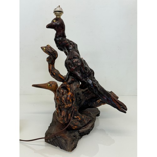 82 - Naive art, a French folk art lamp base from a carved vine section as bird and snake figures amongst ... 