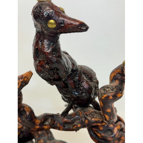 82 - Naive art, a French folk art lamp base from a carved vine section as bird and snake figures amongst ... 