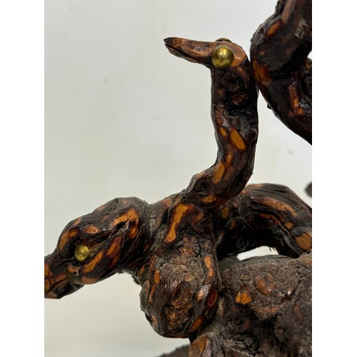 82 - Naive art, a French folk art lamp base from a carved vine section as bird and snake figures amongst ... 